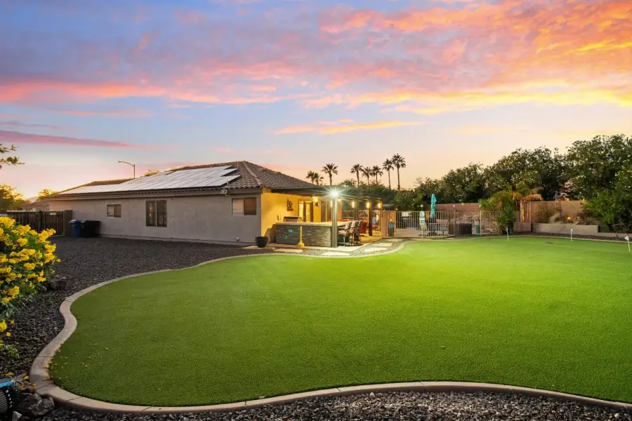 Large, open backyard with beautiful Southwestern landscaping
