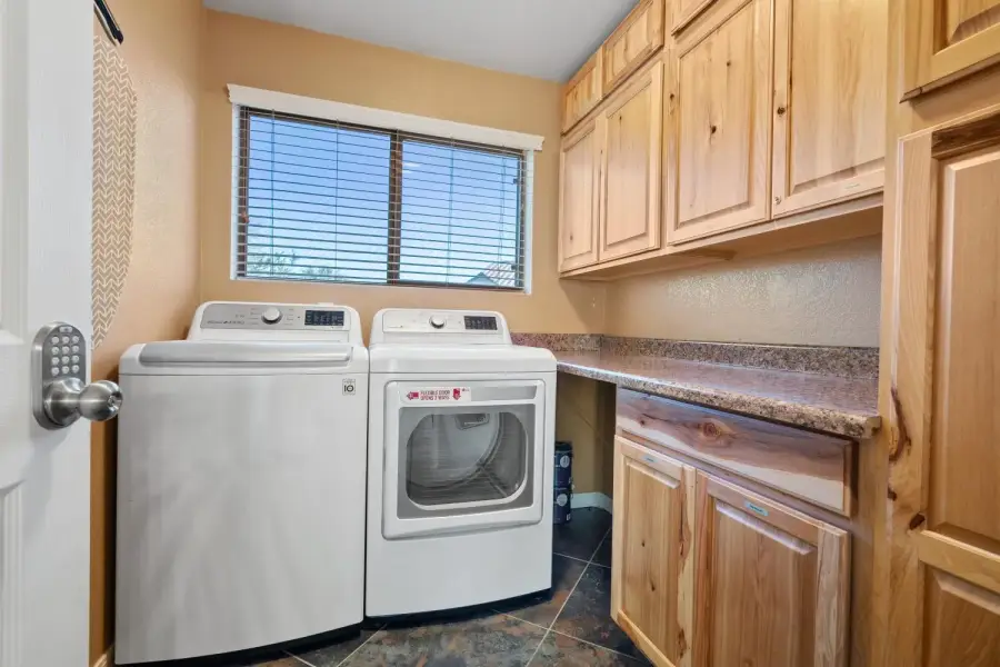 Separate laundry room with newer appliances